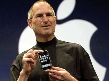 Steve Jobs picking up his iPhone and slams it to the ground